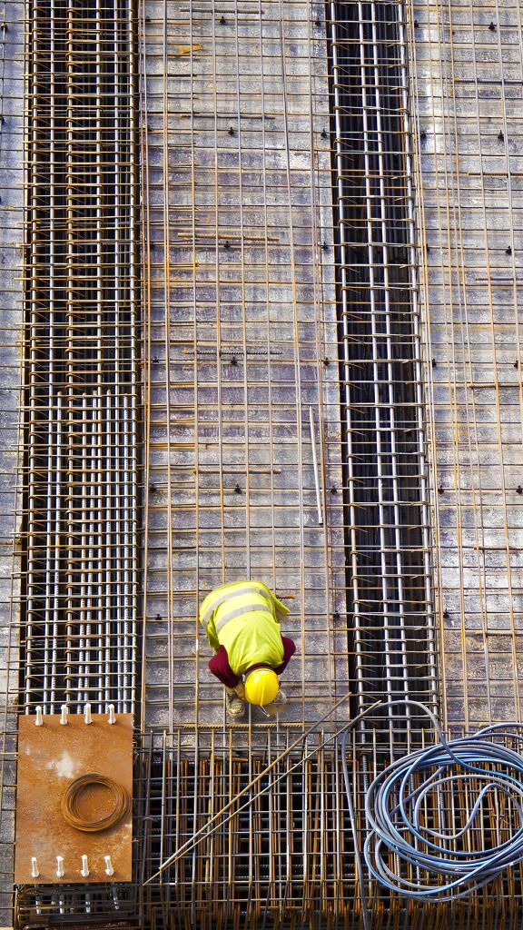 Exclusive Guide to Ivory Coast’s Best Construction Materials 2 workers putting metal structure construction 1 1